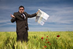 Businessman Lost In Field Stock Images