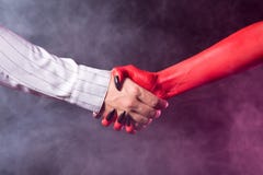 Businessman making a deal with devil Royalty Free Stock Photo Businessman making a deal with devil Royalty Free Stock Photo