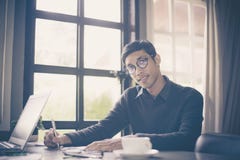 Businessman making notes while working at office stock photography Businessman making notes while working at office stock photography
