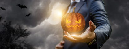 Businessman showing a pumpkin in the halloween. royalty free stock photography Businessman showing a pumpkin in the halloween. royalty free stock photography