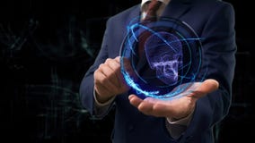 Businessman shows concept hologram 3d skull on his hand royalty free stock image Businessman shows concept hologram 3d skull on his hand royalty free stock image
