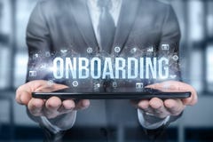 Businessman shows on the tablet the word onboarding