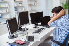 The businessman sitting in front of many screens royalty free stock image The businessman sitting in front of many screens royalty free stock image