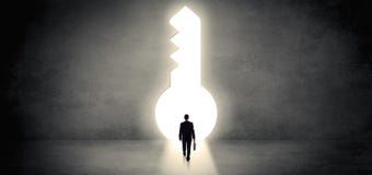 Businessman standing in a big keyhole royalty free stock photography Businessman standing in a big keyhole royalty free stock photography