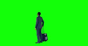 Businessman standing with luggage