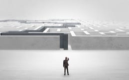 Businessman starting a stated labyrinth royalty free stock images Businessman starting a stated labyrinth royalty free stock images