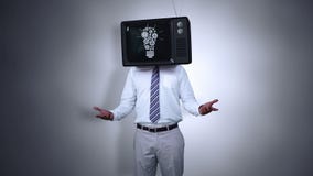 Businessman with tv on his head