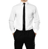 Businessman in a white shirt and tie holding hands in his pocket royalty free stock photography Businessman in a white shirt and tie holding hands in his pocket royalty free stock photography