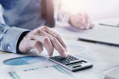 businessman working on desk using calculator for calculate accou Royalty Free Stock Photo businessman working on desk using calculator for calculate accou Royalty Free Stock Photo
