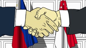 Businessmen or politicians shake hands against flags of Philippines and Singapore. Official meeting or cooperation