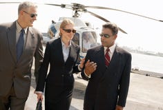 Businesspeople Arriving From Helicopter Royalty Free Stock Photo