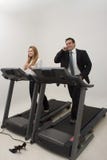 Businesspeople On A Treadmill - Vertical Royalty Free Stock Photography