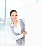 Businesswoman holding a blank white card board royalty free stock photo Businesswoman holding a blank white card board royalty free stock photo