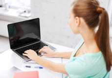 Businesswoman with laptop computer in office royalty free stock photo Businesswoman with laptop computer in office royalty free stock photo