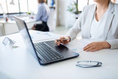 Businesswoman with laptop working at office royalty free stock photography Businesswoman with laptop working at office royalty free stock photography