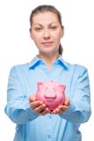 Businesswoman showing piggy bank on white background royalty free stock image Businesswoman showing piggy bank on white background royalty free stock image