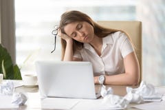 Businesswoman sleeping with head on hand at work royalty free stock photography Businesswoman sleeping with head on hand at work royalty free stock photography