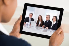 Businesswoman Video Conferencing On Digital Tablet royalty free stock images Businesswoman Video Conferencing On Digital Tablet royalty free stock images