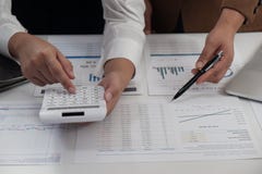 Businesswomen working together in office teamwork brainstorming accounting business concept stock photo Businesswomen working together in office teamwork brainstorming accounting business concept stock photo