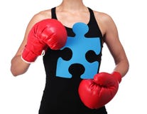 Bust of a woman boxer holding a puzzle piece stock photography Bust of a woman boxer holding a puzzle piece stock photography