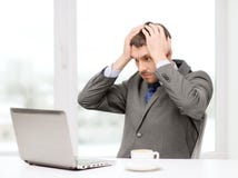 Busy businessman with laptop and coffee stock photography Busy businessman with laptop and coffee stock photography