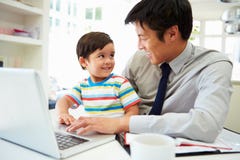 Busy Father Working From Home With Son Stock Image Busy Father Working From Home With Son Stock Image