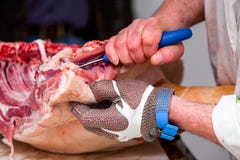 Butcher Cutting Fresh Pork Meat