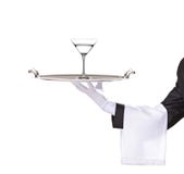 A butler holding a tray with cocktail on it. Isolated on white stock image A butler holding a tray with cocktail on it. Isolated on white stock image