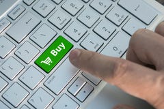 buy button on computer keyboard showing business concept A male finger presses a color button on a gray silver keyboard of a royalty free stock photo buy button on computer keyboard showing business concept A male finger presses a color button on a gray silver keyboard of a royalty free stock photo