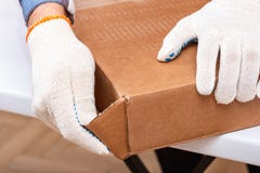 The buyer collects ready-to-assemble folding table. Ready-to-assemble furniture. Worker opens the box with furniture royalty free stock images The buyer collects ready-to-assemble folding table. Ready-to-assemble furniture. Worker opens the box with furniture royalty free stock images