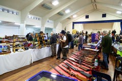Buyers and sellers at a gun show in NZ stock image Buyers and sellers at a gun show in NZ stock image