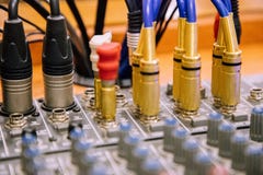 Cables entering mixer table perspective view blurred stock image Cables entering mixer table perspective view blurred stock image