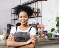 Cafe owner standing with arms crossed Stock Image Cafe owner standing with arms crossed Stock Image
