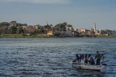Cairo, Egypt February 11 2012: Egyptian family in a Small Boat on the River Nile in the middle of Cairo stock photos Cairo, Egypt February 11 2012: Egyptian family in a Small Boat on the River Nile in the middle of Cairo stock photos