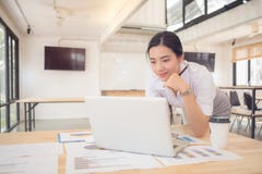 Calculating the cost of postage of a small package, Small business enterprise concerns royalty free stock images Calculating the cost of postage of a small package, Small business enterprise concerns royalty free stock images