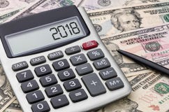 Calculator with money - 2018 Stock Photography Calculator with money - 2018 Stock Photography