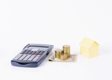 Calculator and money coins stack and Home paper for Loans money Royalty Free Stock Images Calculator and money coins stack and Home paper for Loans money Royalty Free Stock Images