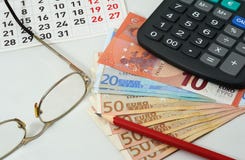 Calendar, glasses, red pencil, euros and calculator Stock Images Calendar, glasses, red pencil, euros and calculator Stock Images