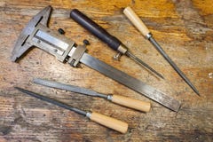 Caliper, files and pricker on a table in a workshop Royalty Free Stock Photo Caliper, files and pricker on a table in a workshop Royalty Free Stock Photo