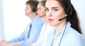 Call center operators at work. Focus at business woman in headset stock photography Call center operators at work. Focus at business woman in headset stock photography