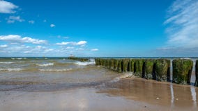 Old wooden piles protecting the beach in Miedzyzdroje against waves royalty free stock images Old wooden piles protecting the beach in Miedzyzdroje against waves royalty free stock images