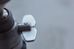 Camera mount with screw-thread close-up on a blurred background. instrument for photo equipment macro. tripod head stock photos Camera mount with screw-thread close-up on a blurred background. instrument for photo equipment macro. tripod head stock photos