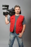 Cameraman in rood vest royalty-vrije stock foto's Cameraman in rood vest royalty-vrije stock foto's