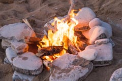 Camp fire on rock beach bonfire royalty free stock image Camp fire on rock beach bonfire royalty free stock image