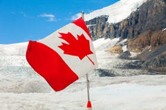 Canadian flag on athabasca glacier with sun royalty free stock photography Canadian flag on athabasca glacier with sun royalty free stock photography