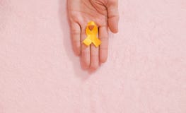 Cancer awareness hand ribbon top view, vintage picture style donate healthcare concept stock photography Cancer awareness hand ribbon top view, vintage picture style donate healthcare concept stock photography