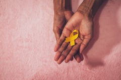 Cancer awareness hand ribbon top view, vintage picture style donate healthcare concept stock photography Cancer awareness hand ribbon top view, vintage picture style donate healthcare concept stock photography