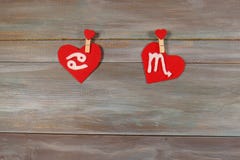 Cancer and scorpion. signs of the zodiac and heart. wooden backg royalty free stock photo Cancer and scorpion. signs of the zodiac and heart. wooden backg royalty free stock photo