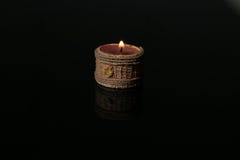 Candle on black glass royalty free stock photography Candle on black glass royalty free stock photography