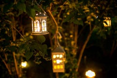 Candlestick House On The Tree In Nigth With Blur Lights Stock Photo